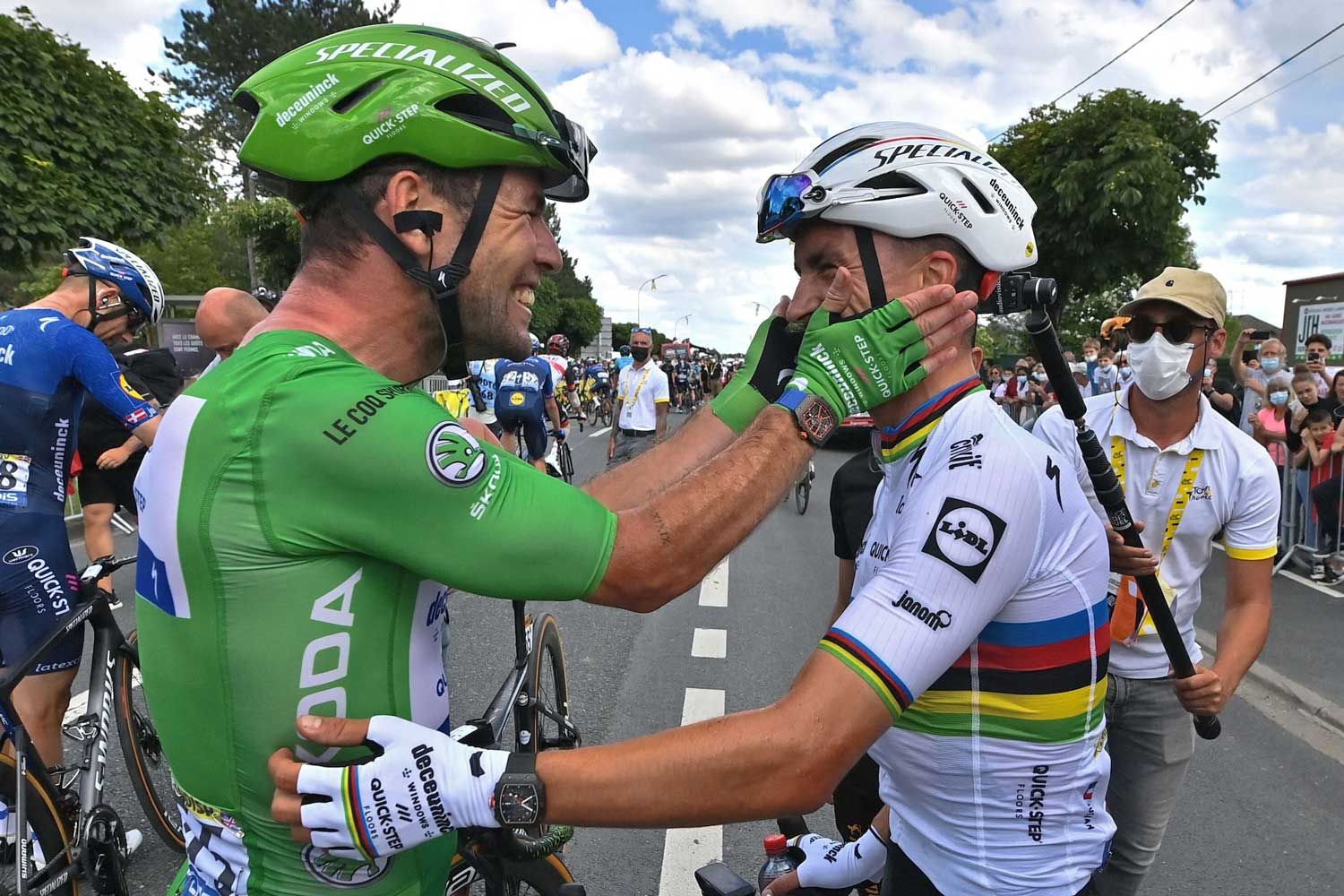 Britain’s Mark Cavendish, wearing the best sprinter’s green, celebrates with France’s Julian Alaphilippe after winning the sixth stage of the Tour de France cycling race over 160.6 kilometers (99.8 miles) with start in Tours and finish in Chateauroux, France, Thursday, July 1, 2021. (David Stockman, Pool Photo via AP
