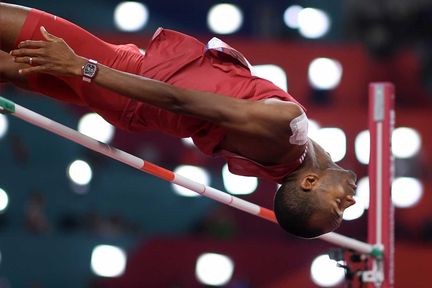 Qatar's Mutaz Essa Barshim competes in the Men's High Jump final at the 2019 IAAF Athletics World Championships at the Khalifa International stadium in Doha on October 4, 2019, with the with the RM 67-02 Automatic Mutaz Essa Barshim – High Jump on his wrist (Photo by Kirill KUDRYAVTSEV / AFP) (Photo by KIRILL KUDRYAVTSEV / AFP via Getty Images)